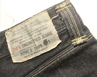 Vintage Levis 501 Engineered Jeans leg twist stitched June 9 1999 size 31 dark blue denim