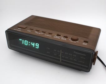 Vintage 1970s Panasonic digital alarm clock radio AM/FM receiver green LED lighted time display woodgrain 70s mod design home audio