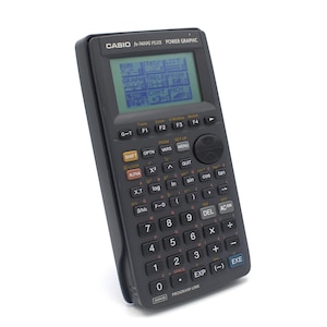 Vintage Casio Power Graphic calculator fx-7400G scientific graphing digital LCD pixel graphics display