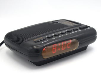 Vintage 1980s digital alarm clock radio AM/FM receiver red LED lighted time display Digit-Tech 80s style design nightstand