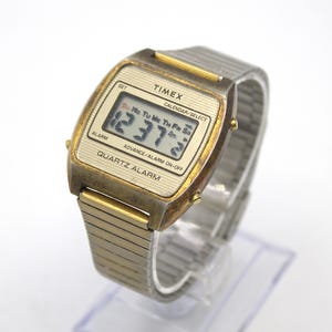 Vintage 1980s Timex digital watch gold tone chronograph alarm weekday date calendar LCD quartz display steel band true 80s fashion