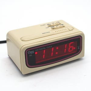 Vintage 1980s Cosmo Time digital alarm clock red LED lighted display beige pink accent Snooze Battery Backup 80s mod design