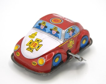 Vintage tin toy Fire Department Volkswagen spring keyed wind-up stamped metal toy car