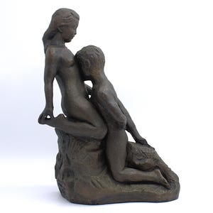 May include: A set of three ceramic canisters with lids, featuring a blue and white floral pattern. The canisters vary in size, with the largest measuring approximately 8 inches in height. They are arranged on a white surface.