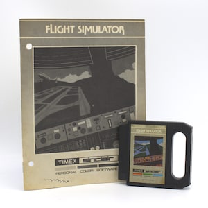 May include: A vintage "Flight Simulator" game cartridge and manual. The manual is beige with the title "Flight Simulator" and the Timex Sinclair logo. The cartridge is black with a colorful label featuring a landscape scene.