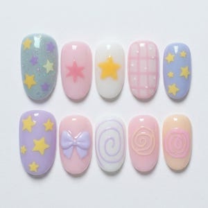 May include: A set of ten press-on nails featuring pastel colors and various designs including yellow stars, a light purple bow, white plaid patterns, and swirling lines. The nails are arranged in two rows of five, showcasing a variety of finishes.