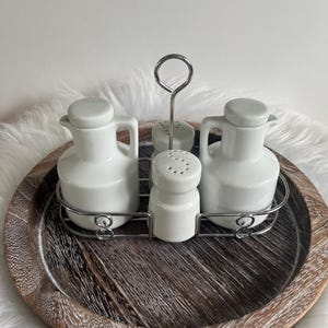 Vintage oil and vinegar set / Salt and pepper shakers with metal stand / White condiment set / Farmhouse kitchen decor