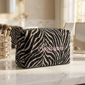 May include: A set of three ceramic mugs with a speckled, matte finish. The mugs are in shades of cream, light gray, and dark gray. Each mug has a simple, minimalist design, perfect for coffee or tea.