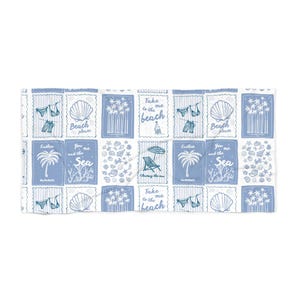 May include: A blue and white beach towel with a repeating pattern of beach-themed illustrations. The design includes seashells, palm trees, and phrases like "Take me to the beach" and "Beach please."