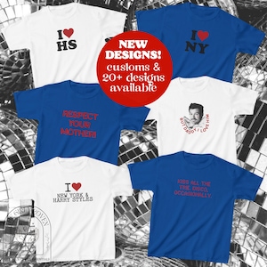 May include: A collection of six short-sleeved t-shirts in white and blue. The shirts feature various graphic prints including text like I LOVE HS, I LOVE NY, RESPECT YOUR MOTHER, BUT DADDY I LOVE HIM, I LOVE NEW YORK & HARRY STYLES, and KISS ALL THE TIME.