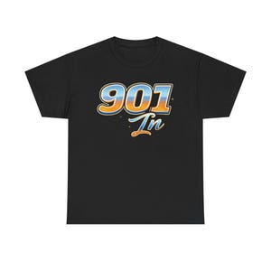 May include: Black t-shirt with the text "901 In" in a retro font. The numbers and text are in blue, orange, and white, with a gradient effect. The shirt is a classic crew neck style.