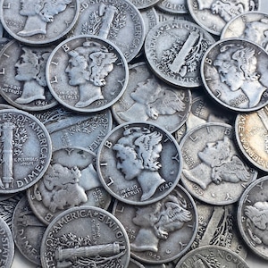 May include: A collection of silver-colored United States dimes featuring the Walking Liberty design. The coins are arranged in a random pattern, with some coins overlapping others. The coins are all dated between 1927 and 1944.