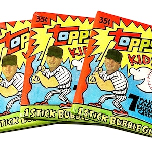 May include: Three vintage Topps Kids baseball card packs. Each pack features a baseball player illustration and the text "Topps Kids." The packs include 7 Major League Baseball cards and bubble gum.