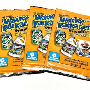May include: Three orange Wacky Packages All-New Series 3 sticker packs featuring parody graphics of Spite soda, Snorox cleaner, and Gripe-Nuts cereal. Each pack displays the text 6 Parody Stickers and mentions rainbow foil stickers and magnets.