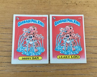 Choice of Garbage Pail Kids Drippy Dan 23a or Leaky Lou 23b Original Series 1 Card GPK Topps 1st Series 1985 OS1