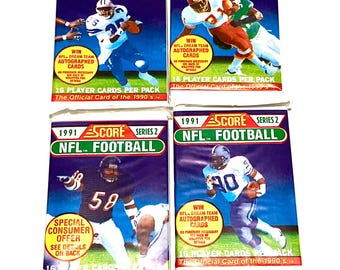 May include: Four packs of 1991 Score Series 2 NFL Football trading cards. Each pack features a football player in action, with text including "Win NFL Dream Team Autographed Cards" and "16 Player Cards Per Pack."