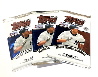 May include: Three unopened packs of 2005 Topps Series One Major League Baseball cards. Each pack features a baseball player in a pinstripe uniform. The packs are silver and white with the Topps logo and text.