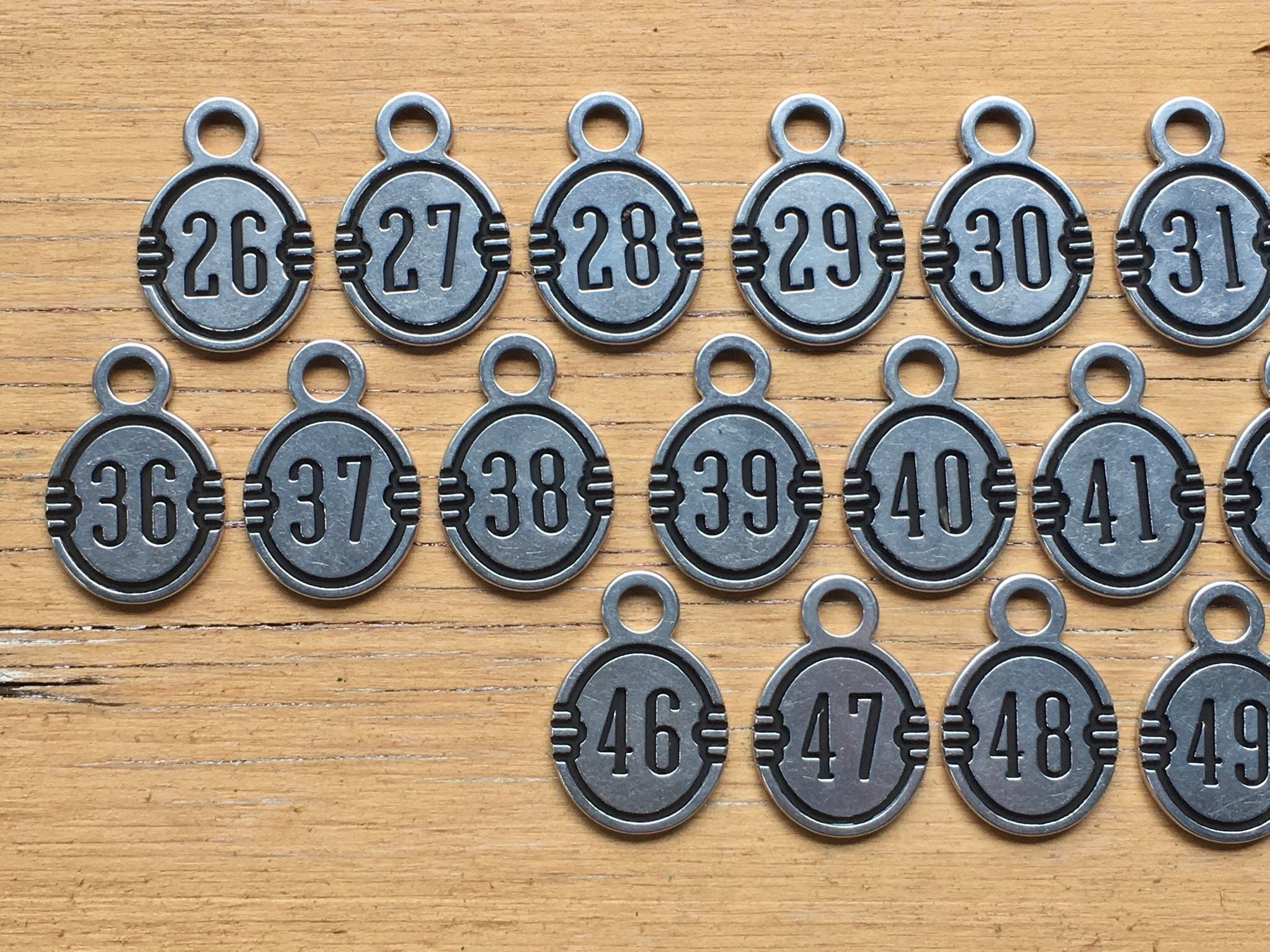 METAL NUMBER TAGS 26-50 NEW IN BAG 6A234A 
