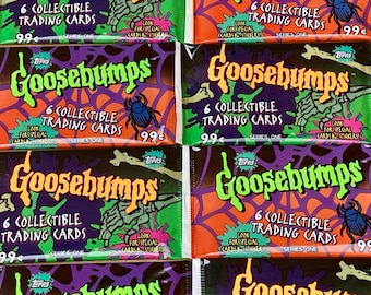 May include: Four packs of Goosebumps trading cards. Each pack features a different spooky image, including a spider web, a skeleton hand, and a beetle. The packs are all orange, green, and purple with the text "Goosebumps" in a green and orange font. Each pack contains 6 collectible trading cards and costs 99 cents.