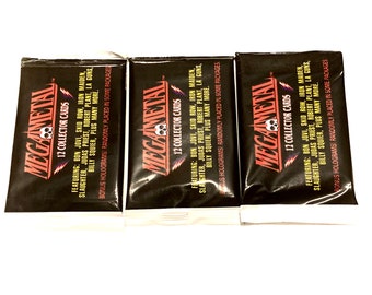 May include: Three sealed packs of MegaMetal trading cards. Each pack features a black background with a skull and lightning bolt logo. The text on the front of the packs lists the bands included in the collection: Bon Jovi, Skid Row, Iron Maiden, Slaughter, Judas Priest, Robert Plant, LA Guns, and Billy Squier.