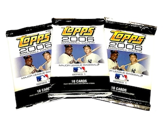 May include: Three unopened packs of 2006 Topps baseball cards. Each pack features a black and white background with a photo of baseball players and the text "Topps 2006 Baseball Cards" in yellow and black. The packs are labeled "Series 1" and state that each pack contains 10 cards.
