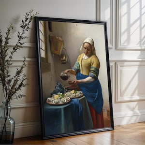 May include: Framed print of a classic painting showing a woman pouring liquid. The woman is dressed in a yellow top, blue apron, and white head covering. Two plates of oysters are on a table covered with a blue cloth.