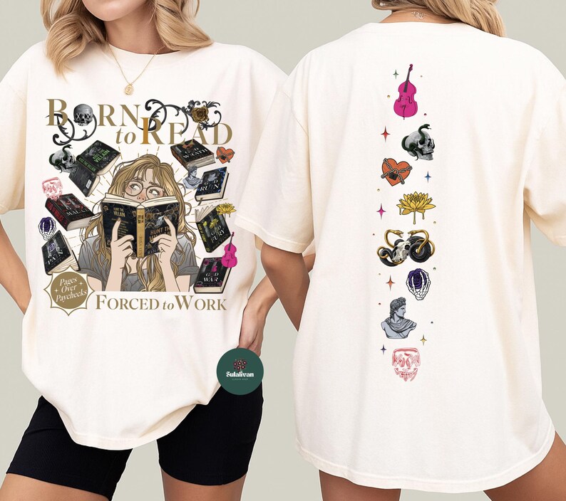 May include: Cream-colored t-shirt with the text "BORN to READ" and "FORCED to WORK". The front features a graphic of a person reading surrounded by books and skulls. The back has a vertical design with various illustrations.