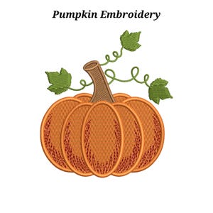 May include: An embroidery design featuring an orange pumpkin with a brown stem and green leaves with curly vines. The text Pumpkin Embroidery is printed in black above the pumpkin. The design uses orange, brown, and green thread colors.