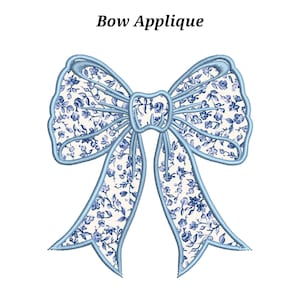 May include: A detailed bow applique in light blue, featuring a floral design in blue and white. The text "Bow Applique" is above the bow. This decorative element could be used for various craft projects or embellishments.