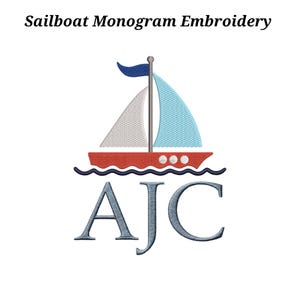 May include: Sailboat monogram embroidery design featuring a red boat with white and blue sails, a blue flag, and the initials AJC in a blue-grey color. The text "Sailboat Monogram Embroidery" is at the top.