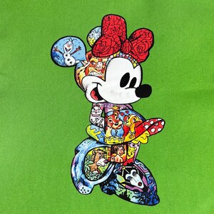 May include: A colorful Minnie Mouse illustration on a green background. Minnie Mouse is depicted with a red bow and a black nose. The illustration is filled with images of Disney characters, including Olaf, Chip and Dale, and characters from The Lion King.