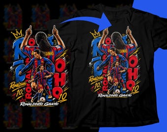 May include: Black t-shirt featuring a graphic of Ronaldinho in a soccer uniform, with the text "Ronaldinho Gaucho 10." The design includes a crown and the number 10. The image is a vibrant illustration.