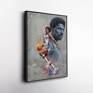 May include: A framed art print featuring a basketball player in a Sixers uniform, mid-jump with a flaming basketball. The artwork has a watercolor effect with blue, red, and orange accents, and a large portrait of the player in the background.