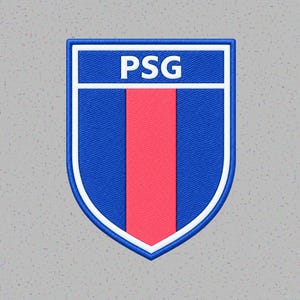 May include: A shield-shaped embroidered patch featuring a blue background with a central vertical red stripe. The top section contains the white text PSG, all enclosed within a thick white and blue border, showcasing a textured fabric finish.