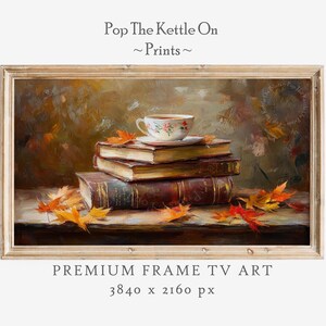 May include: A framed print of a still life featuring a teacup on a stack of books, with autumn leaves scattered around. The artwork has warm, earthy tones and the text "Pop The Kettle On ~ Prints ~ PREMIUM FRAME TV ART 3840 x 2160 px".