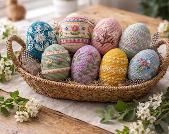 May include: A wicker basket displays eight handmade crochet Easter eggs. The eggs are in various colours, including blue, pink, green, and yellow, and feature floral and geometric patterns. The text "Handmade Crochet Easter Eggs" is at the top.