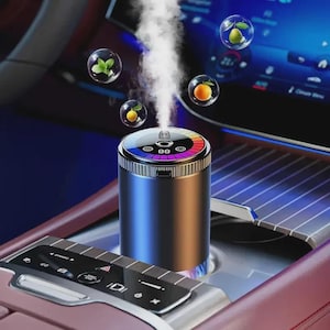 May include: A cylindrical air freshener with a gradient blue and gold finish, emitting a plume of vapor. The top features a color-changing LED ring. Floating bubbles contain citrus and herbs. The device is set in a car interior.