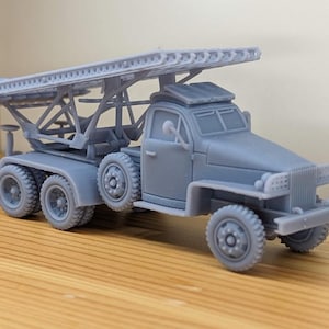 May include: A set of three ceramic mugs with a speckled, matte finish. The mugs are in shades of cream, light gray, and dark gray. Each mug has a simple, minimalist design, perfect for coffee or tea.