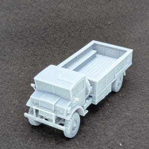 May include: A set of three ceramic mugs with a speckled, matte finish. The mugs are in shades of cream, light gray, and dark gray. Each mug has a simple, minimalist design and a rounded handle.