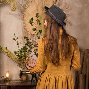 linen dress called the Victoria Dress in the Muted gold color, which is made by KnockKnockLinen.