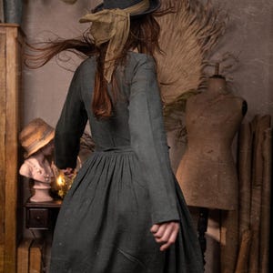 A romantic linen wrap dress with long sleeves and a flowing skirt, featuring pockets for practicality. Soft, breathable, and perfect for a cottage-inspired summer look. Handmade elegance.
