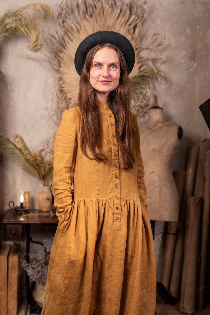 linen dress called the Victoria Dress in the Muted gold color, which is made by KnockKnockLinen.