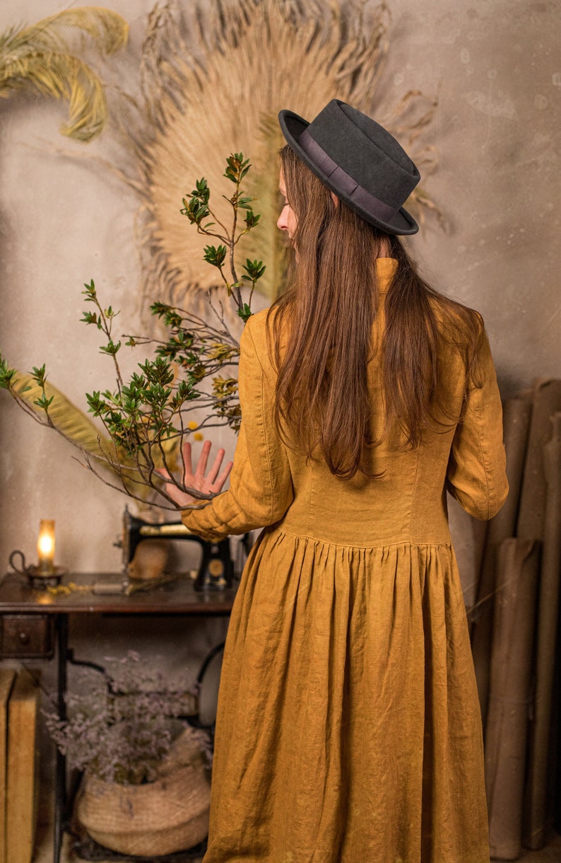 linen dress called the Victoria Dress in the Muted gold color, which is made by KnockKnockLinen.