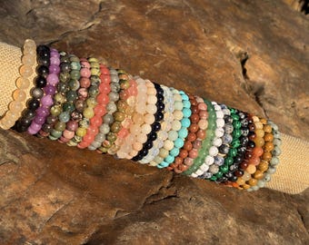 Pulsera artesanal de cuentas de cristal: joyas únicas con piedras preciosas curativas para el bienestar y el estilo.