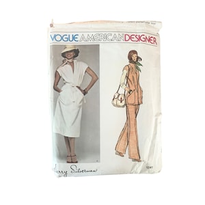 May include: Vintage Vogue American Designer sewing pattern featuring two outfits. The first outfit is a white dress with a V-neck and a tie belt. The second outfit is a brown and white patterned pantsuit with a vest. The pattern is by Jerry Silverman and the pattern number is 1241.