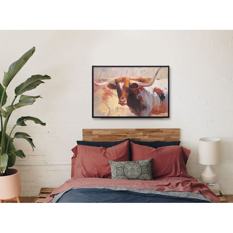 May include: A painting of a brown and white longhorn steer with large horns. The steer is standing in a field with a blurred background of other cattle and a sunset sky.