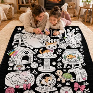 May include: A black and white coloring blanket featuring various pet-themed illustrations including a cat on a scratching post, a dog house, a fish in a bowl, a rabbit, a hamster in a wheel, and a turtle, all outlined for coloring with markers.