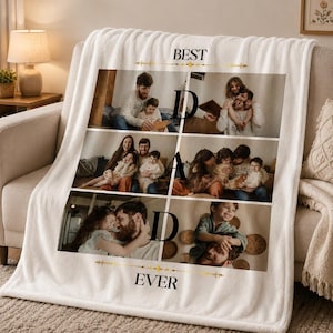 May include: Cream-colored fleece blanket featuring family photos arranged in a grid. The words "BEST DAD EVER" are printed on the blanket. The blanket is draped over a beige sofa.