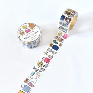 May include: A roll of masking tape with a white background. The tape features a repeating pattern of colorful illustrations including bags, cameras, and animals. The text "Masking tape" is printed on the roll. The tape is 20mm wide and 7 meters long.
