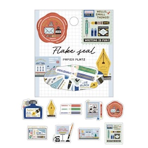 May include: A collection of stationery stickers featuring various designs. The stickers include images of ink bottles, pens, pencils, stamps, and the text "Flake Seal" and "Papier Platz". The color palette includes blue, green, red, and yellow.